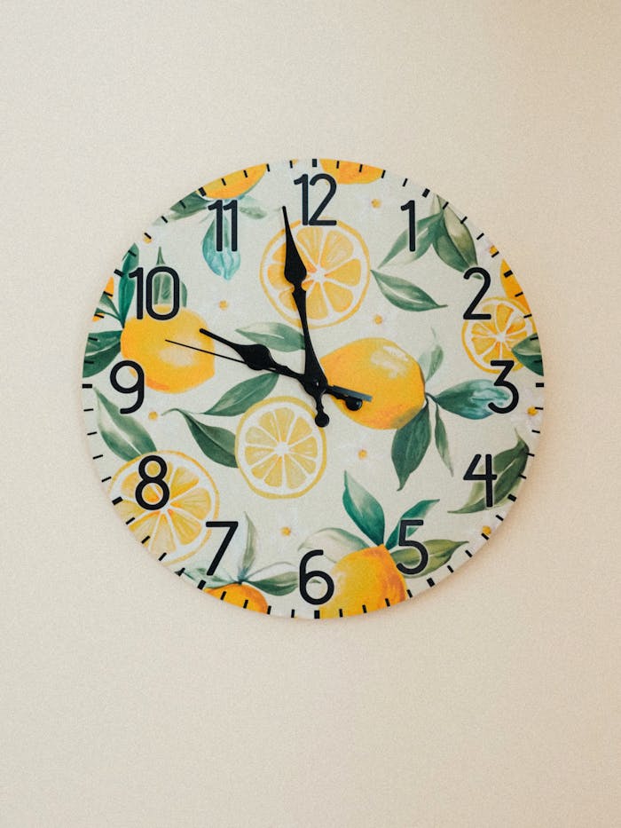 Vibrant wall clock featuring lemons and leaves, ideal for lively interiors.